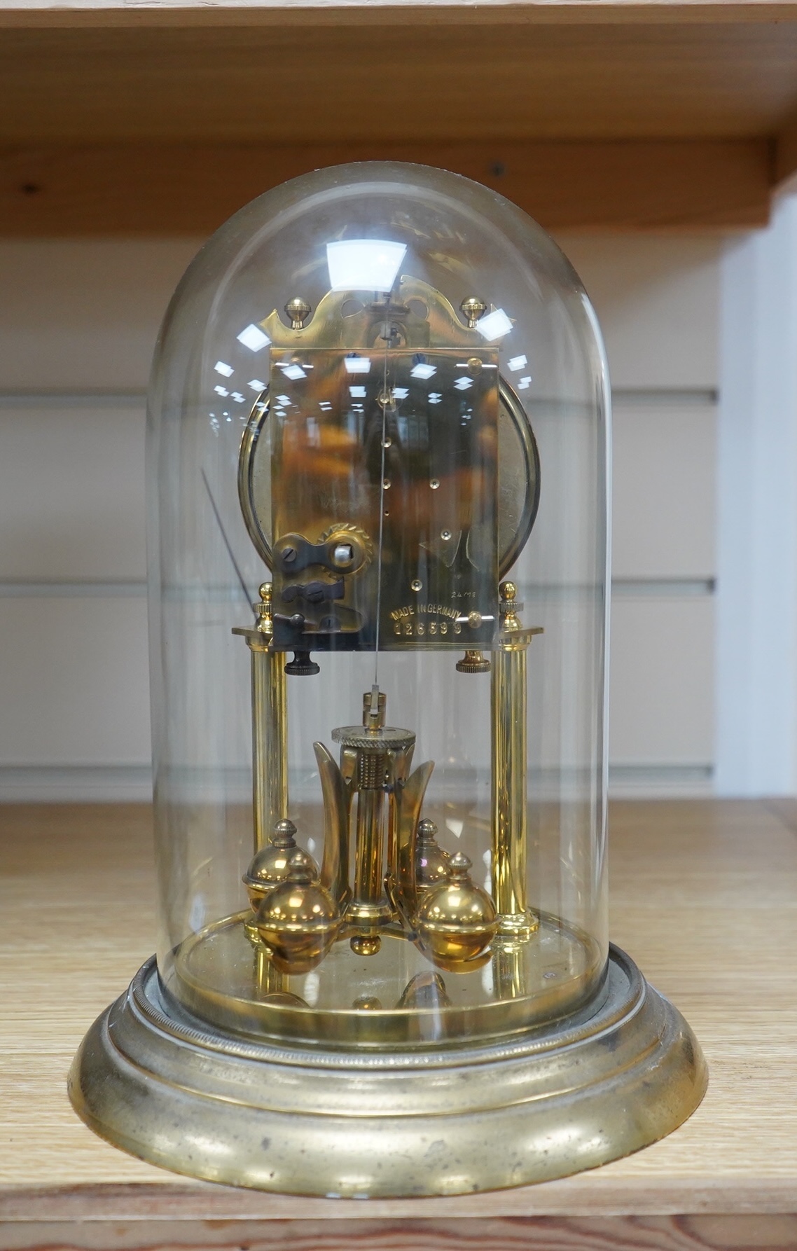 A late 19th century German 400 day torsion clock under dome, 26cm. Condition - fair to good. Not tested